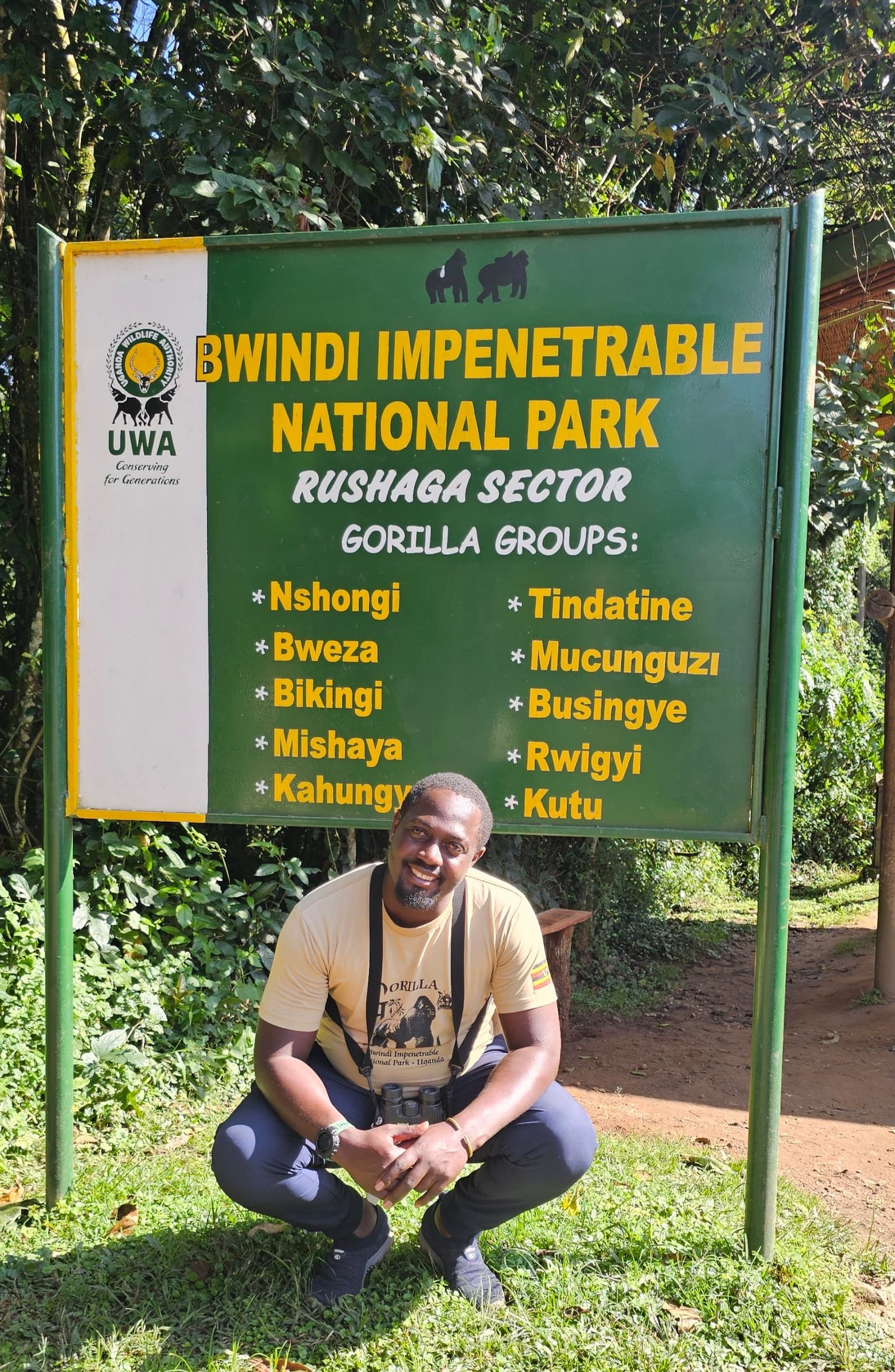 Guide at Bwindi Impenetrable National Park Rushaga sector entrance sign