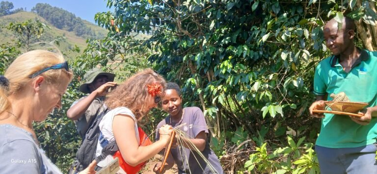 Traveller learning basket weaving with local community guides